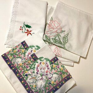 An Assortment of Embroidered Table Linens Napkins
